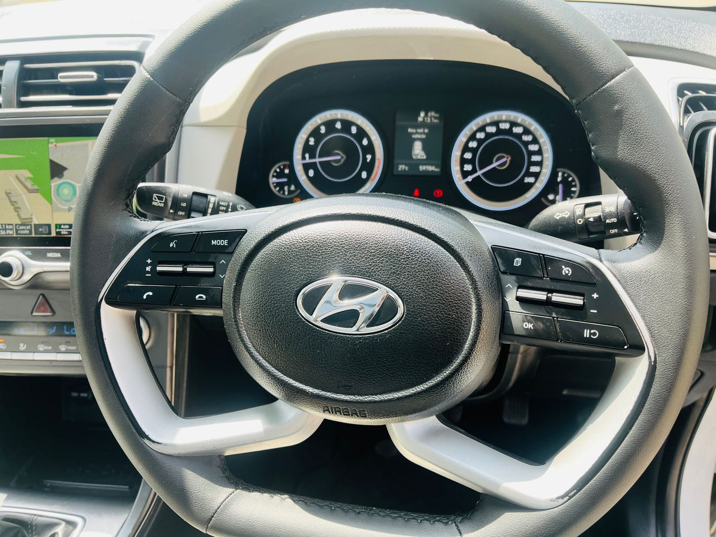 Steering wheel with Hyundai logo in a car interior