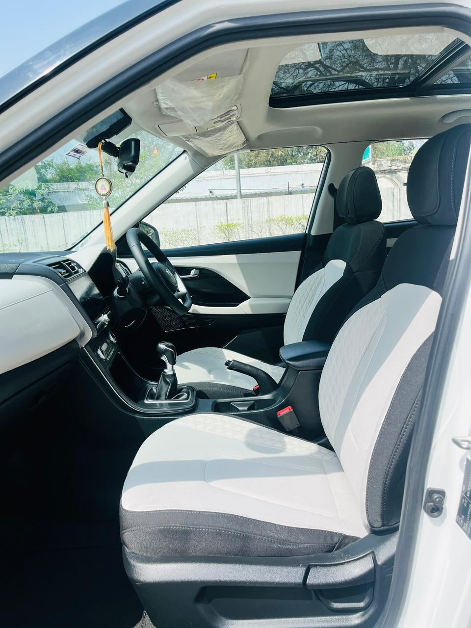 Car interior with gray and white seat covers