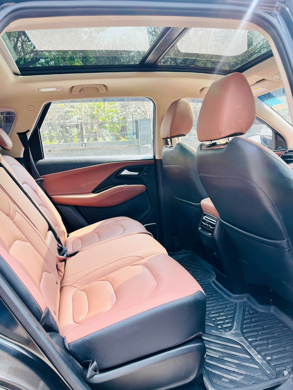 Car interior with pink seats and a sunroof