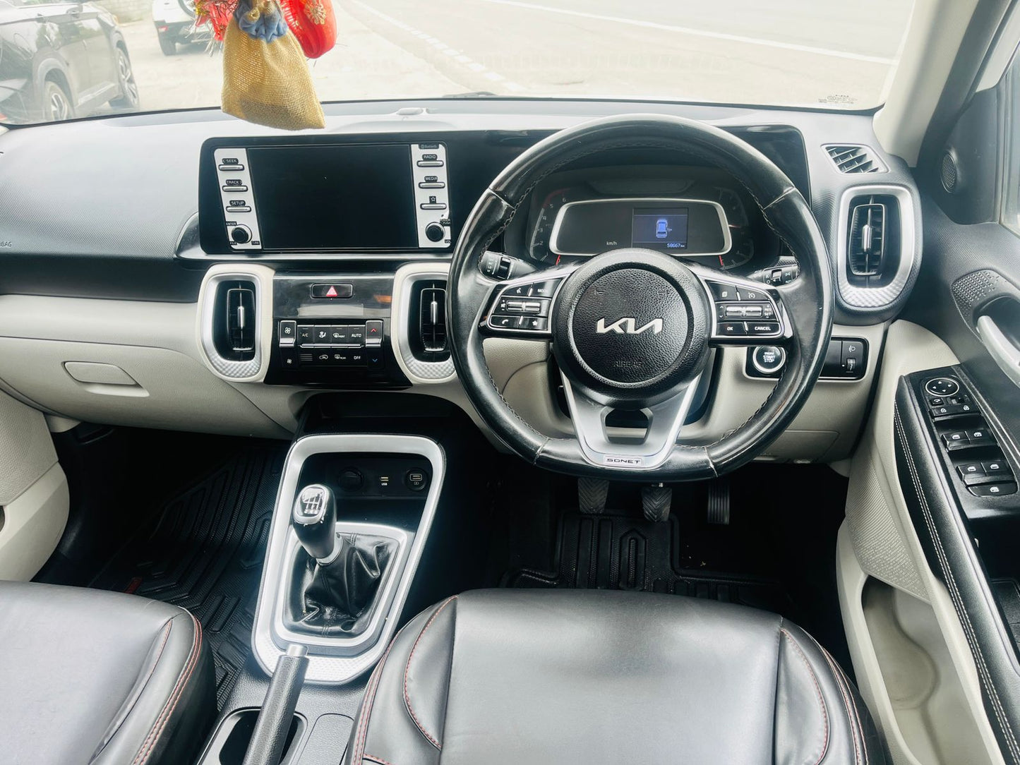 Car interior with steering wheel and dashboard of a Kia vehicle