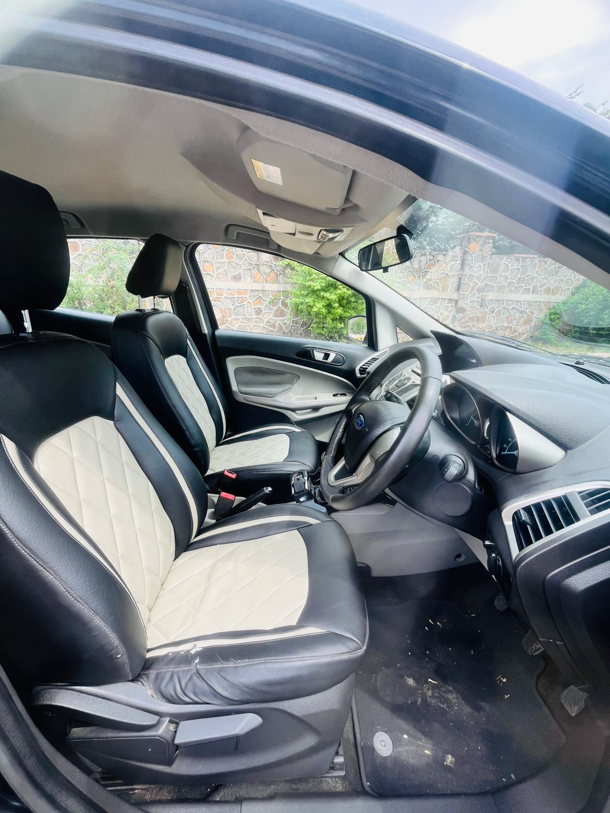 Car interior with black leather seats and dashboard.