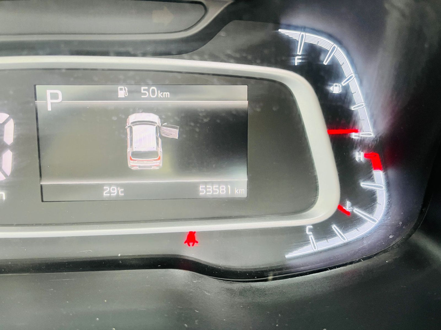 Car dashboard display with navigation system and fuel gauge