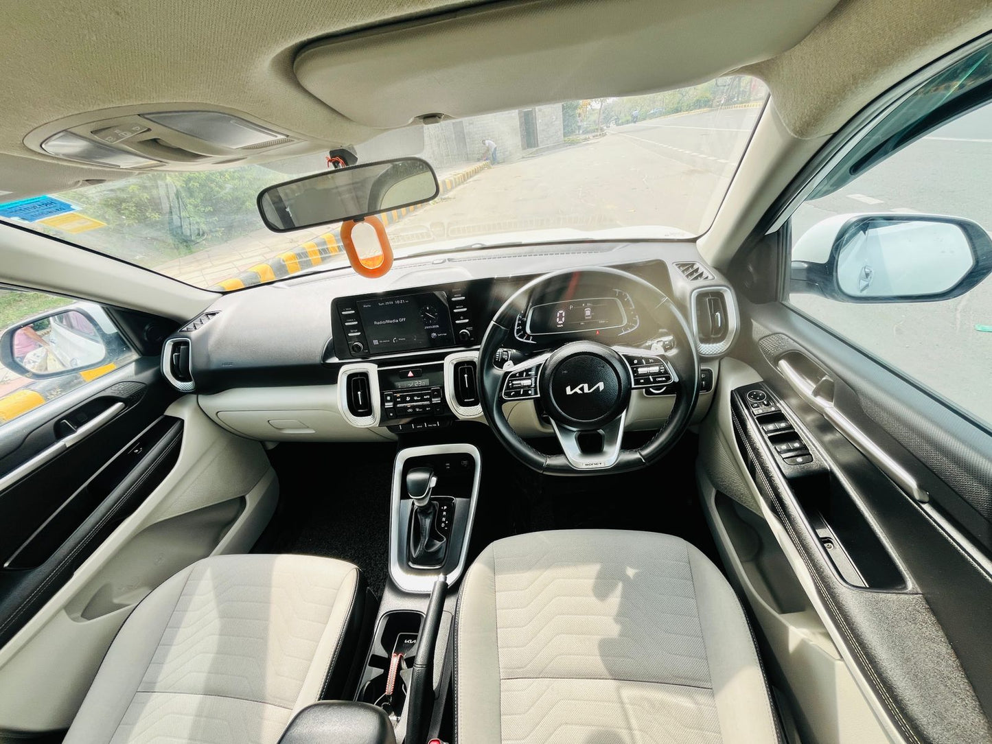 Car interior with steering wheel and dashboard view
