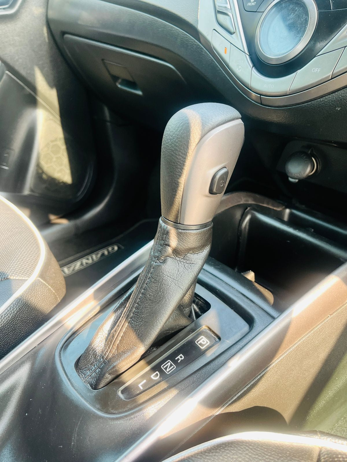 Car gear shift lever in a vehicle interior