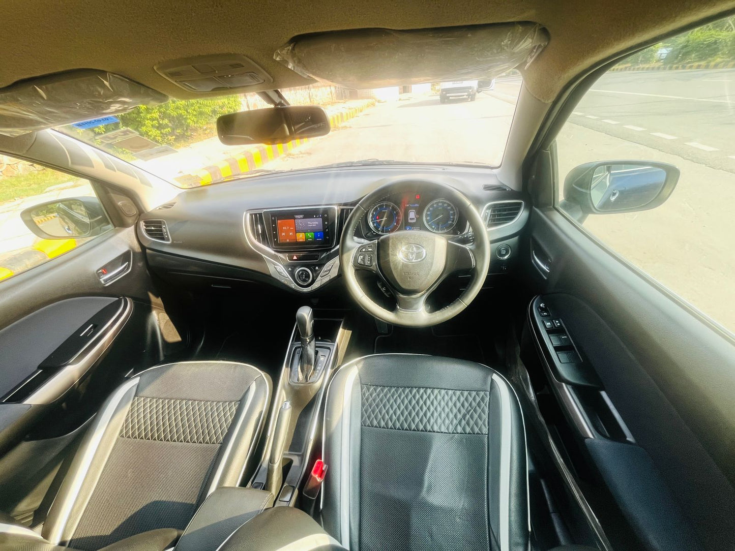 Car interior with dashboard and steering wheel visible