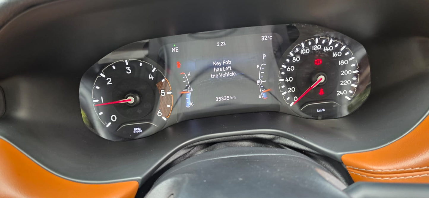 Car dashboard with digital display and speedometer