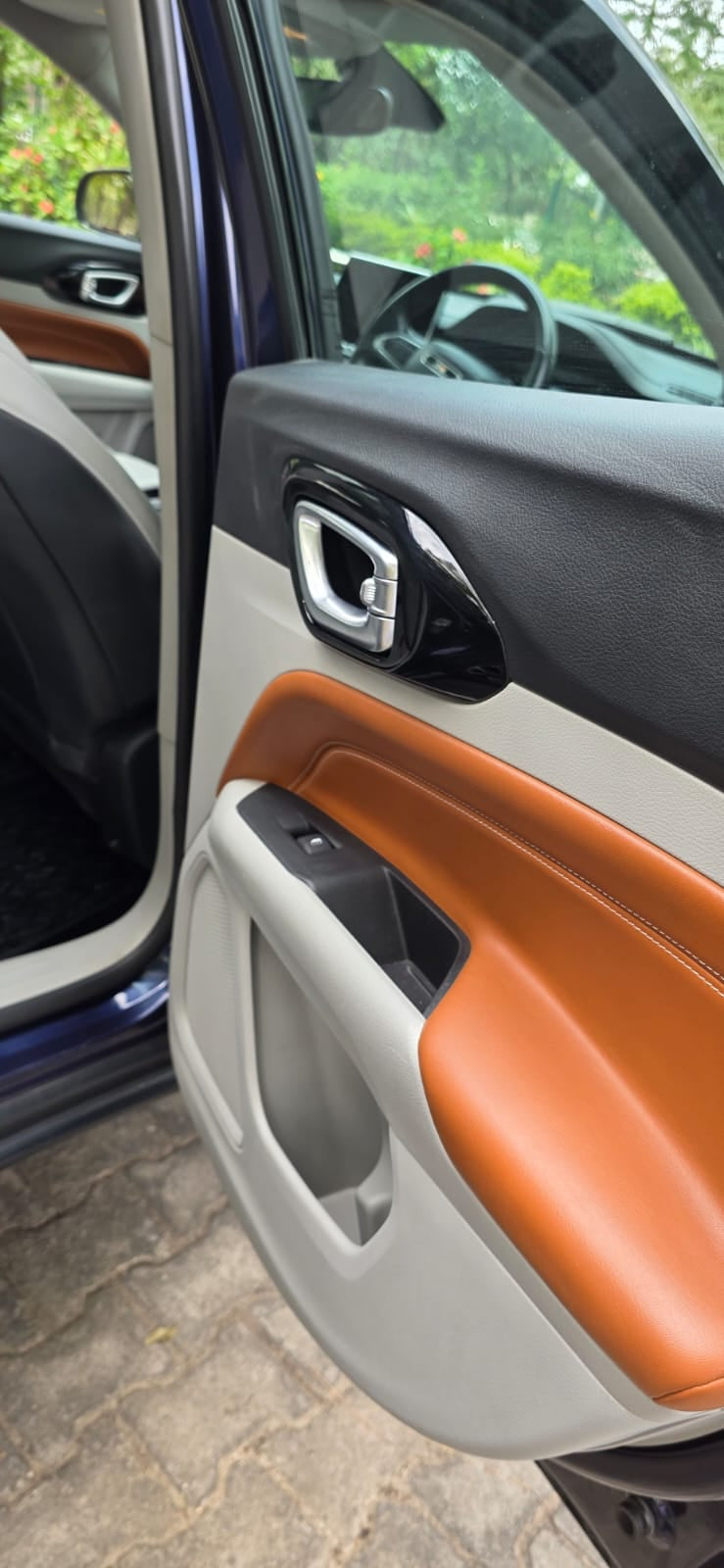 Car door interior with orange and gray accents