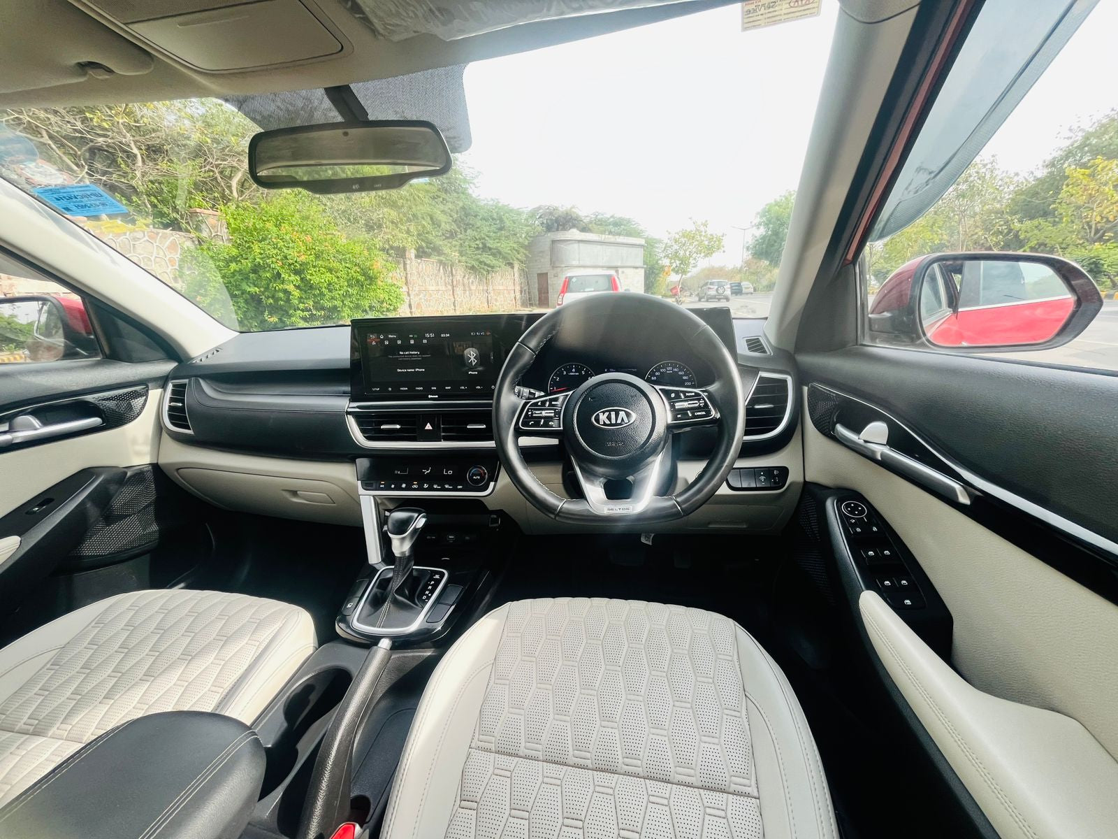 Car interior with steering wheel and dashboard view