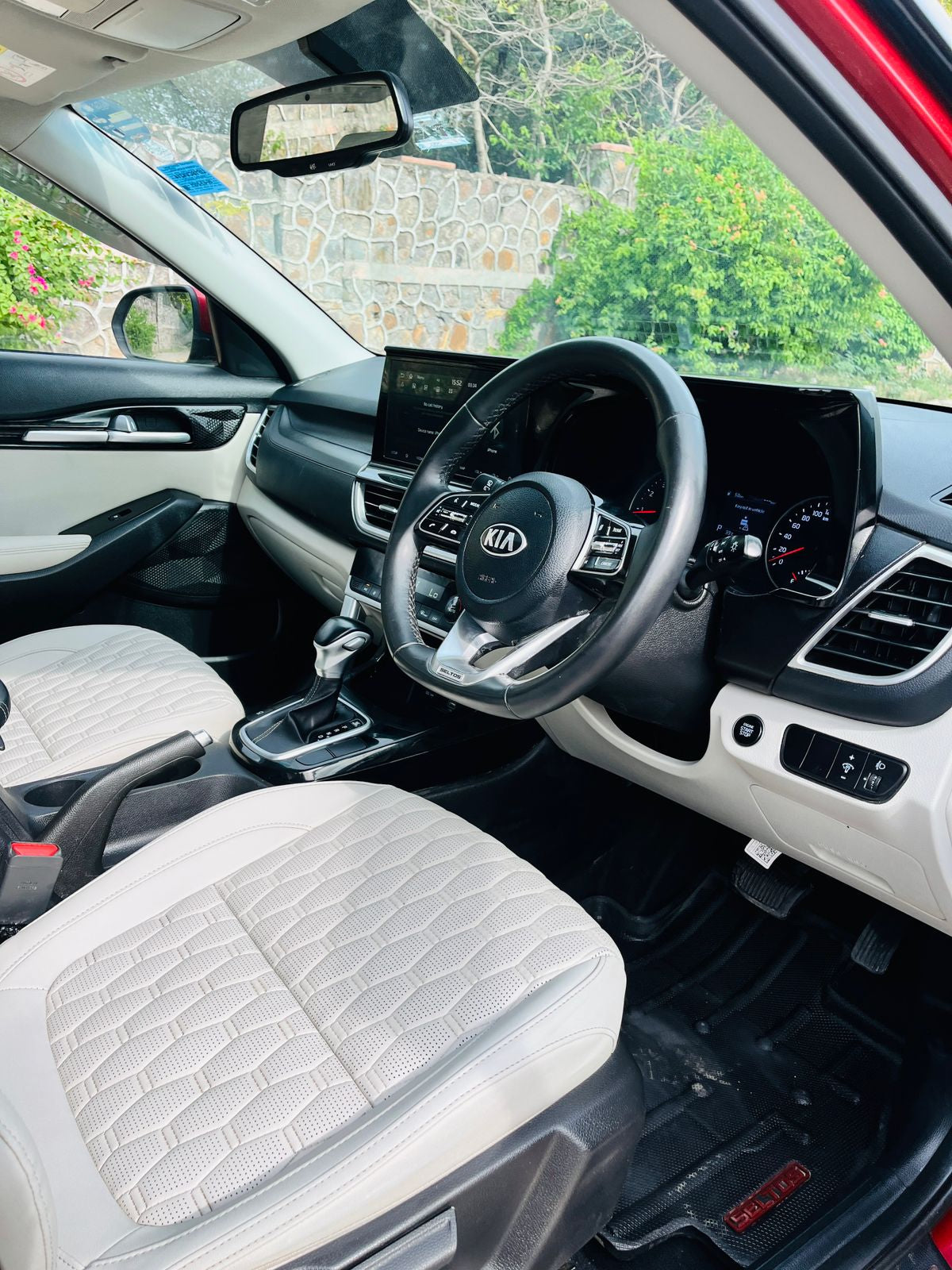 Car interior with steering wheel and dashboard view