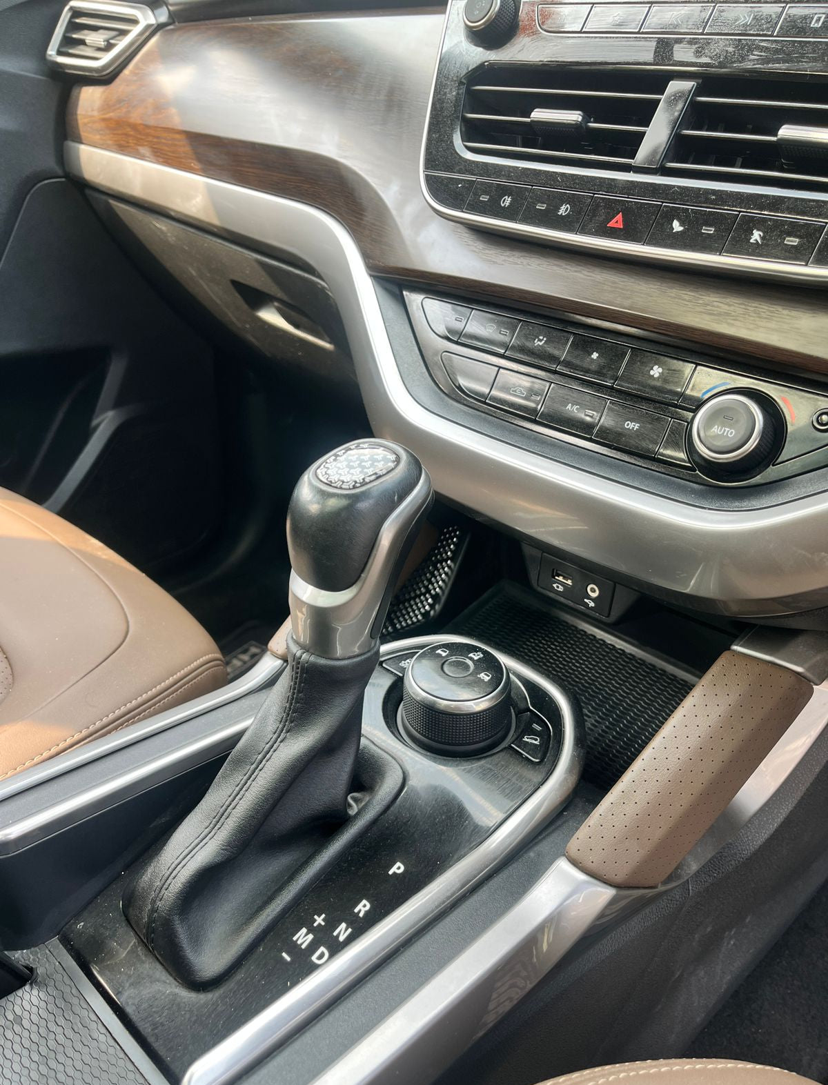 Car interior with gear shift and dashboard controls