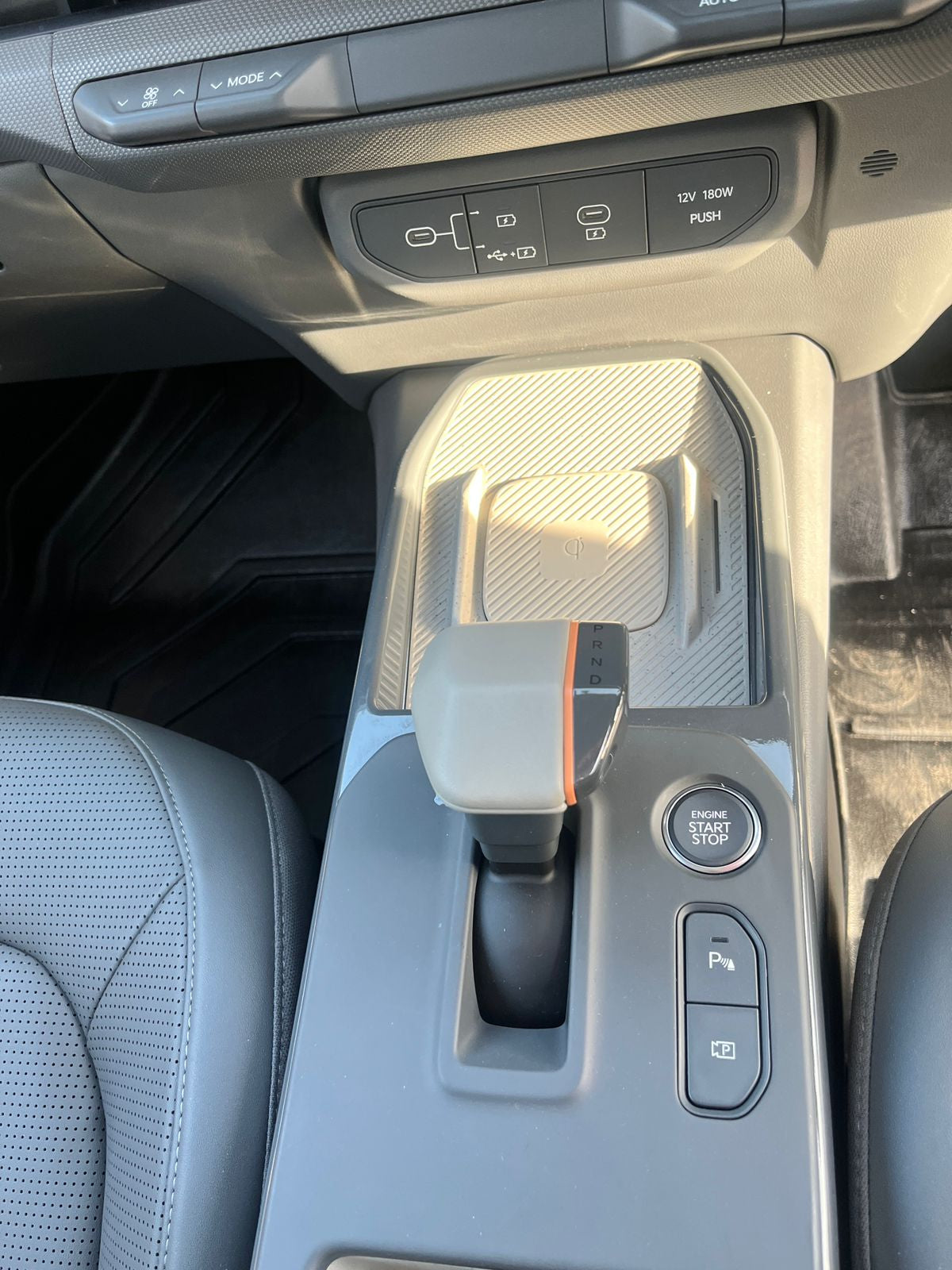Car interior with center console and gear shift in a vehicle.