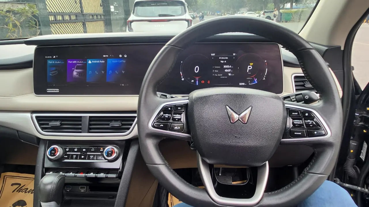 Car interior with steering wheel and dashboard display