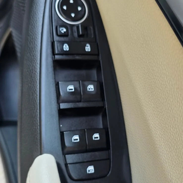 Car window control switch panel inside a vehicle
