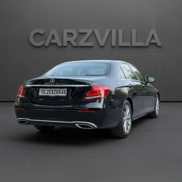 Black Mercedes-Benz car on a dark gray background with 'CARZVILLA' branding.