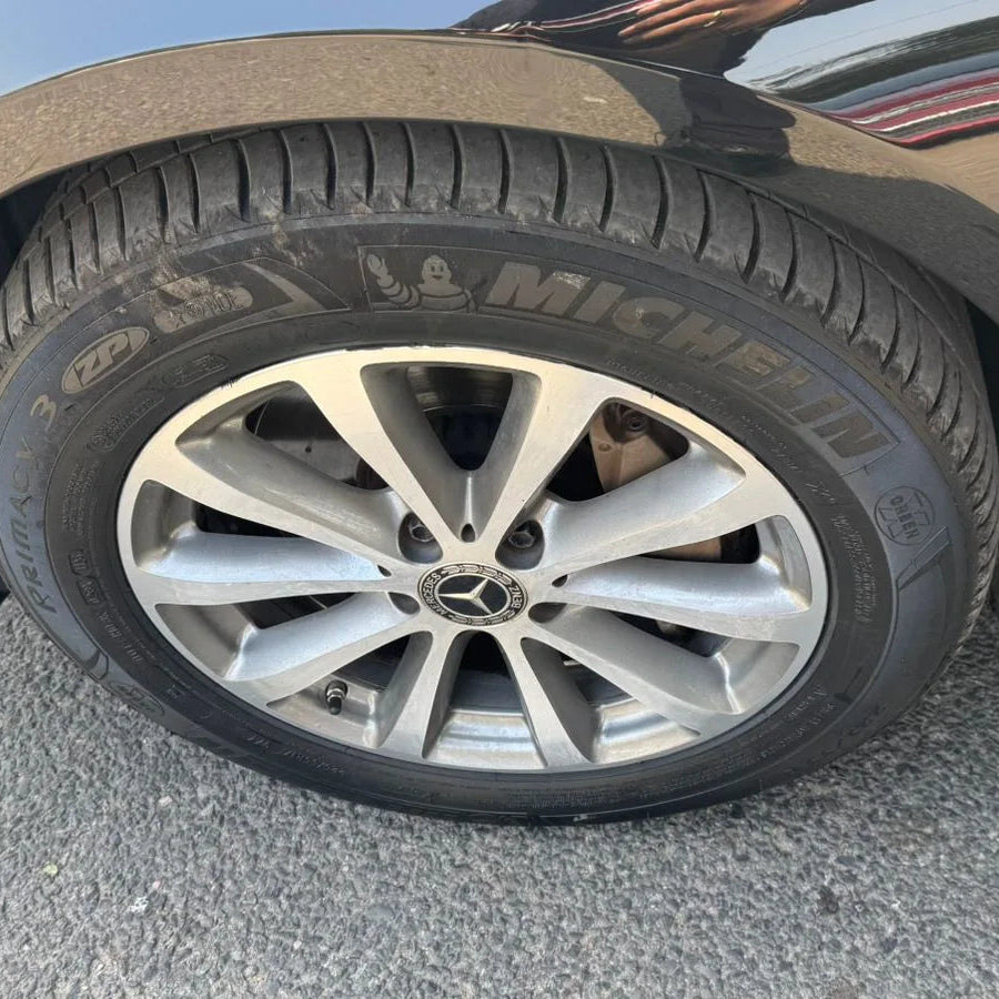 Car tire with Michelin tire on a road
