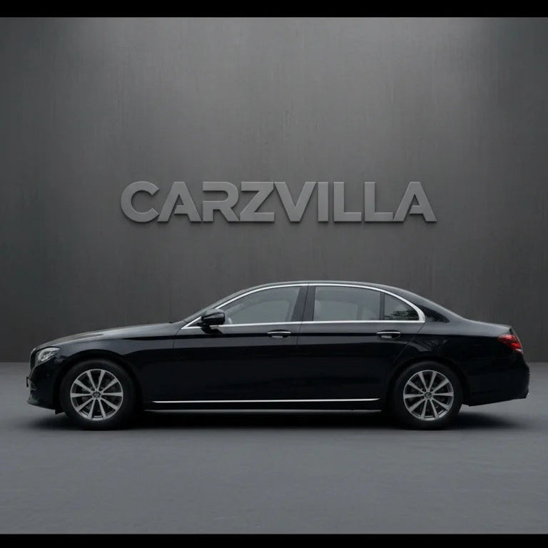 Black car on a gray background with 'CARZVILLA' branding.