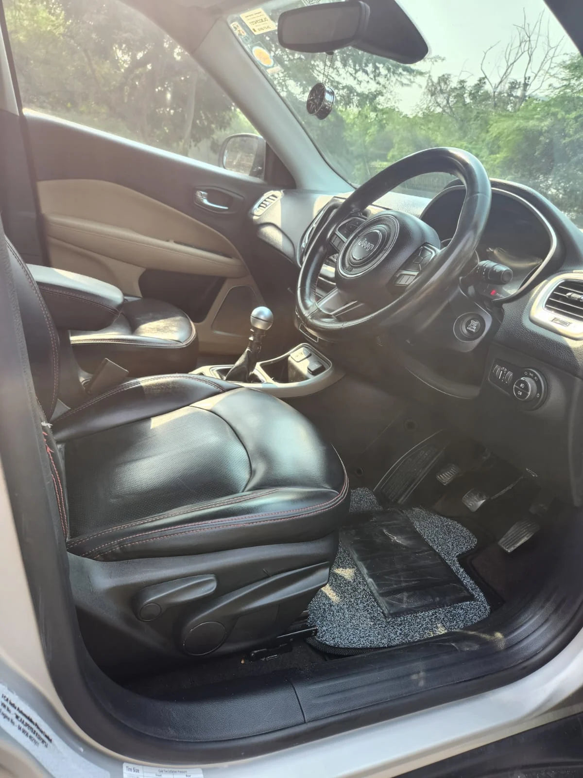 Car interior with steering wheel and dashboard view